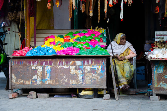 There you can see an old woman selling colors for the festival